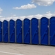 Side view of a row of portable toilets