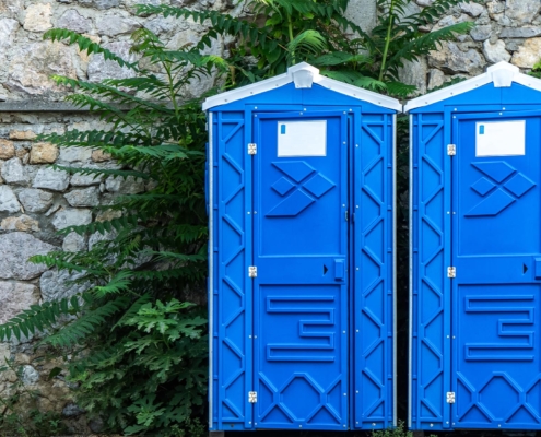 Front view of two porta potties