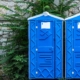 Front view of two porta potties